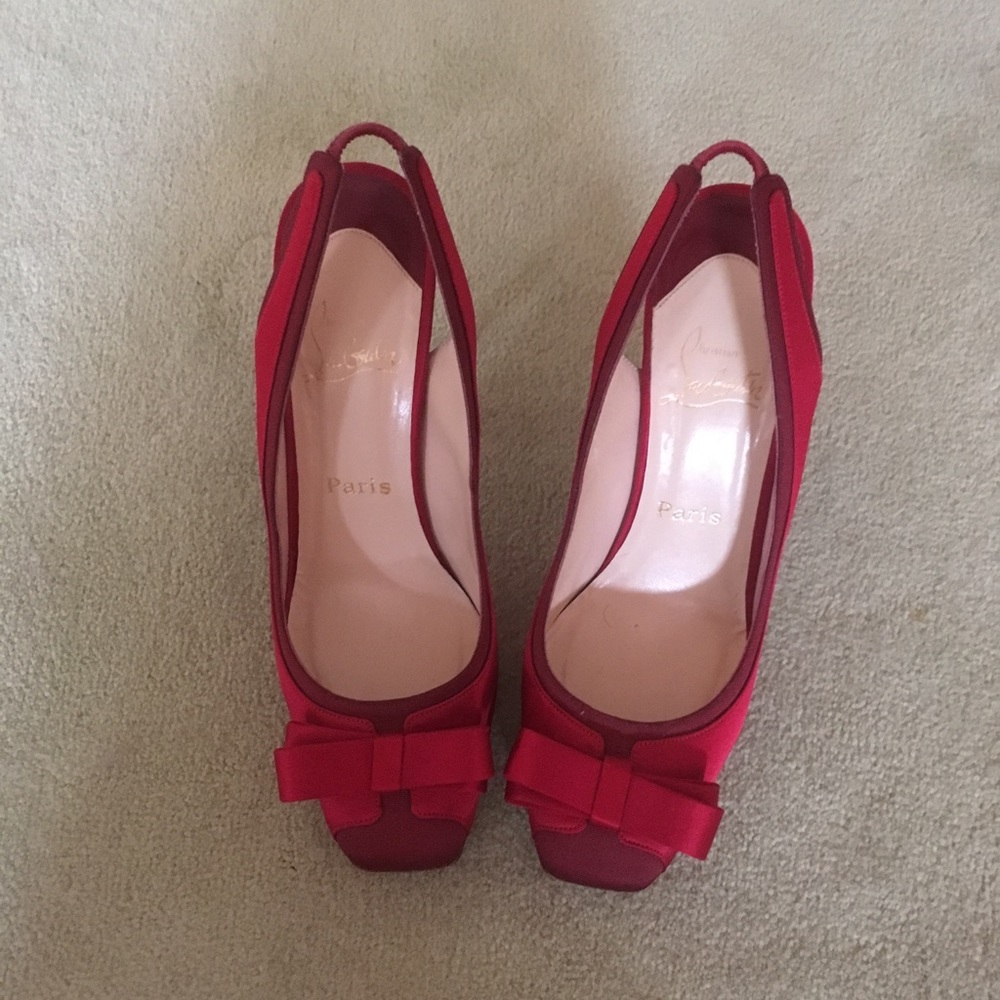 Red satin Louboutin bow-tie stilettos.